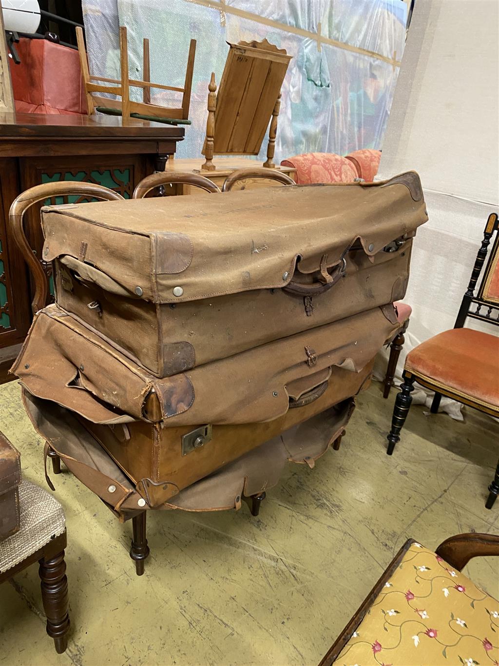 Five various brown leather suitcases, largest 80cm wide